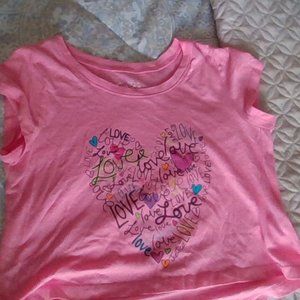 its a top with a hart that has love written on it